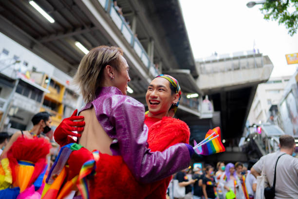 istock Young couple walking with the love parade 1401319550