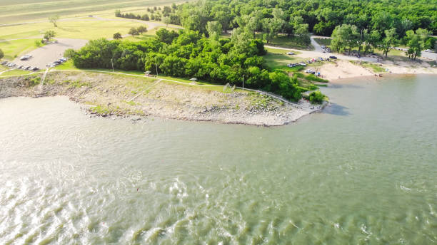istock Top view Oklahoma side of Red River with strong water current generating from Denison Dam hydroelectric station and people bank fishing for striped bass 1401319594