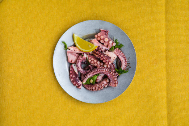 Greek traditional, sea food - Octopus with olive oile and lemon juice. Octopus Ceviche stock photo