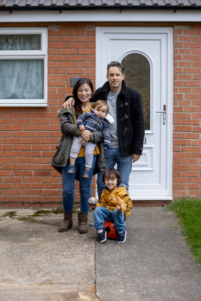 istock Family Outside Our Home 1401321139