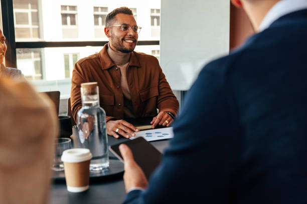 istock Businesspeople having a meeting in a modern office 1401321898