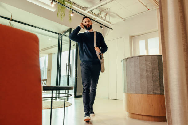istock Businessman speaking on the phone in an office 1401322103