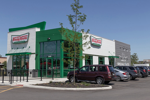 Indianapolis - Circa June 2022: Krispy Kreme doughnut shop. Krispy Kreme has a loyal following for their doughnuts.