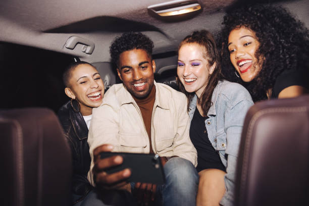 istock Happy friends taking a selfie together inside a car 1401322237