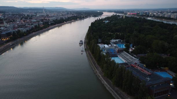 Sunset at Famous Margit Island Drone view of margit island at sunset in summer revealing the Buda and buda mountain range margitsziget stock pictures, royalty-free photos & images