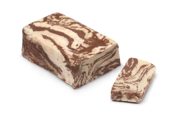 istock Traditional Turkish chocolate halva and a slice on white background close up 1401328197