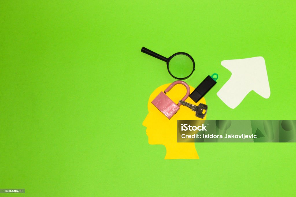 yellow paper head with magnifier, flash memory, key and padlock next to the up arrow, creative design, enhance data protection, green background Accessibility Stock Photo