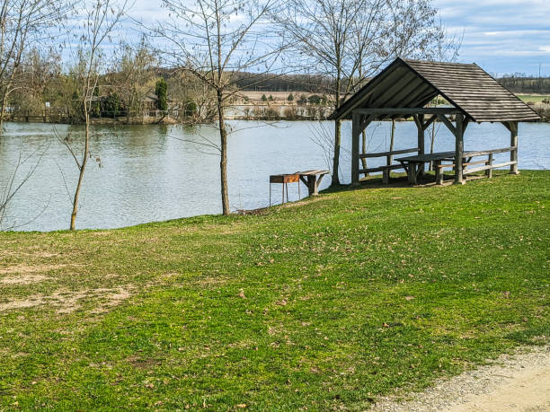 istock lake with gazebos and green grass 1401331146
