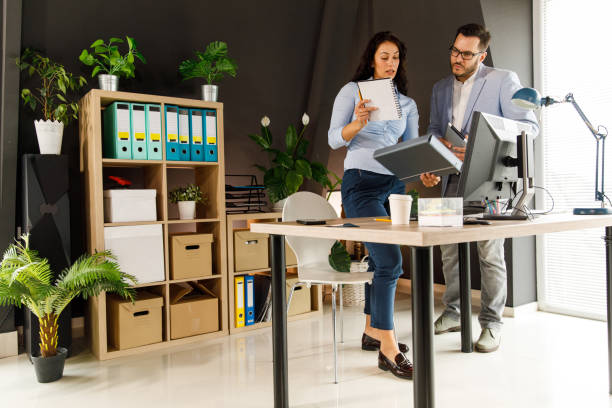 istock Two business colleagues preparing documents and notes for a meeting 1401331311