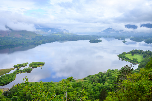 View down Derwent Water towards Keswick in the early morning with low lying cloud