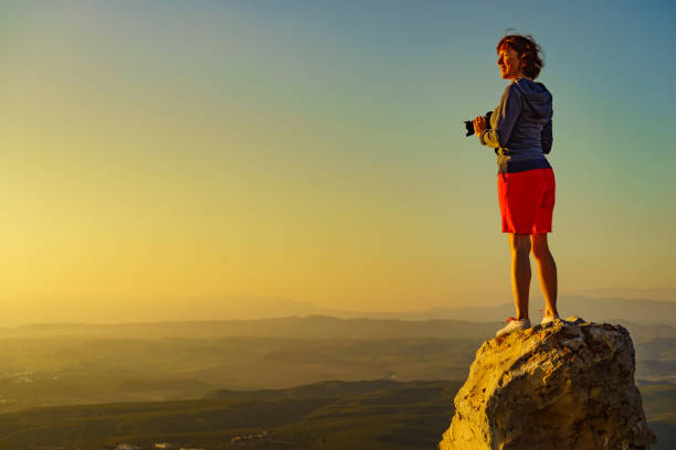 istock Woman with camera take travel photo 1401331616