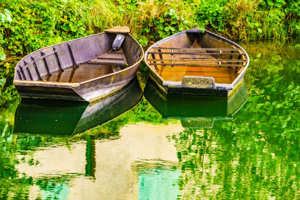 istock Boats on water at riverbank 1401332930