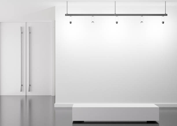 istock Empty white wall in modern art gallery. Mock up interior in minimalist style. Free, copy space for your picture, text, or another design. Empty exhibition space. 3D rendering. 1401332936
