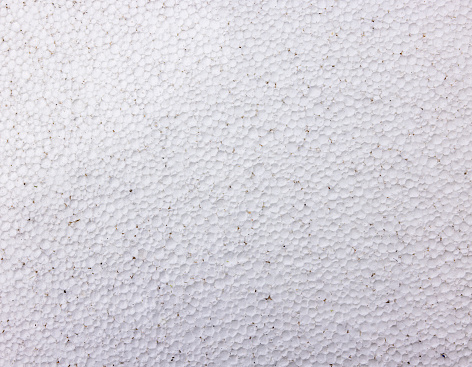 Close-up background of an old polystyrene panel.\nTaken from an old barn. Used for renovation and isolation.