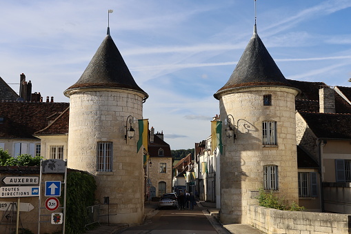 Village entrance with view of two typical towers, village of Chablis, department of Yonne, France