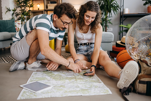 Couple planning vacation trip, searching places to visit