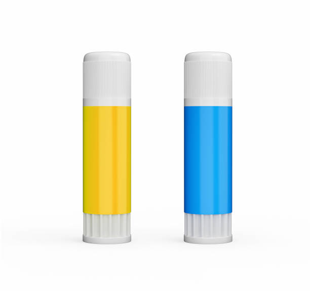 2 pegamentos amarillos y azules aislados sobre fondo blanco ilustración 3d - glue bottle isolated art and craft fotografías e imágenes de stock