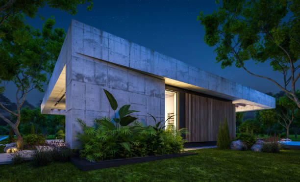 istock 3d rendering of new concrete house in modern style in night 1401339687