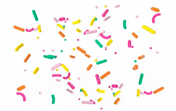 Photo of Colorful sprinkle falling on white isolated background 3d illustration