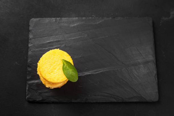 A Stack of Fried Polenta Discs, copy space for your text on the dark background.