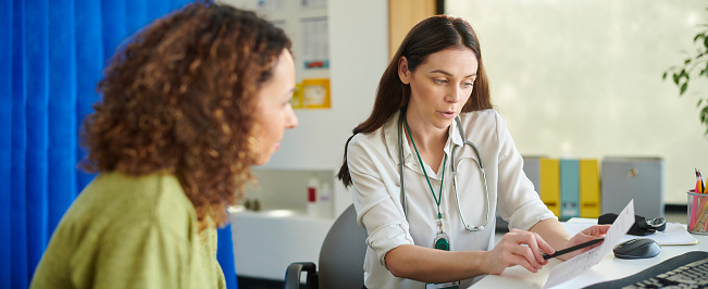 female gp with patient