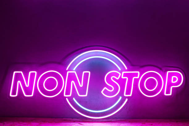 Pink neon sign NON STOP. Trendy style.