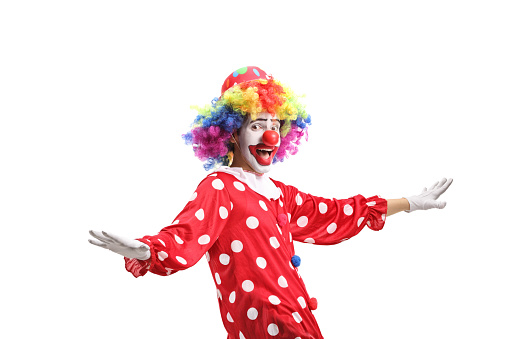 Funny cheerful clown gesturing with hands isolated on white background