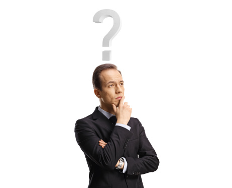 Pensive businessman with a question mark above his head holding his chin and thinking isolated on white background