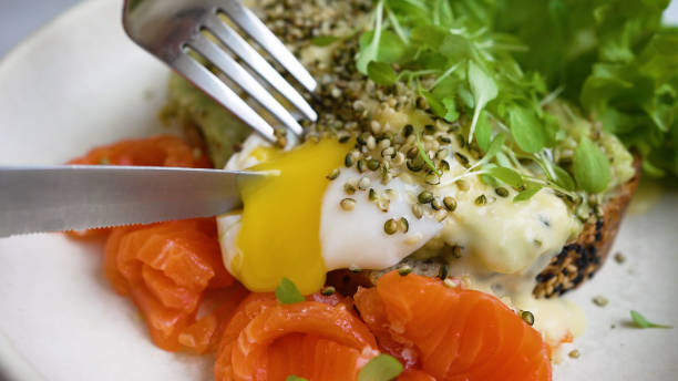 toast with poached egg and trout seasoned with microgreen - food dinner prepared fish gourmet imagens e fotografias de stock