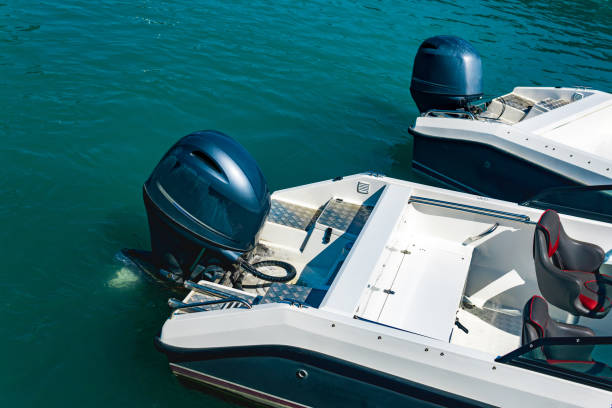 two moored motorboats with outboard motors - outboard motor imagens e fotografias de stock