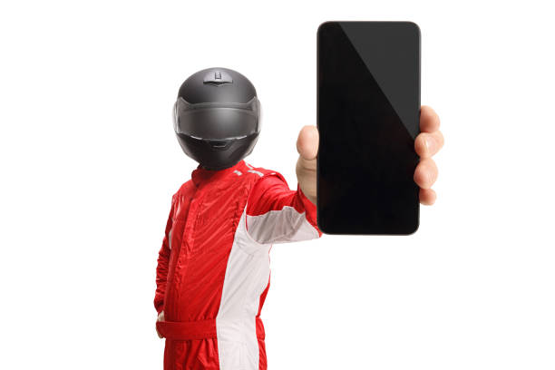 istock Racer with a helmet holding a smartphone 1401343453