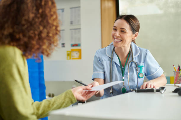 istock female nurse with advice note 1401343456