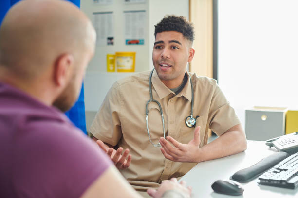 gp explaining to patient male patient with nurse general practitioner stock pictures, royalty-free photos & images