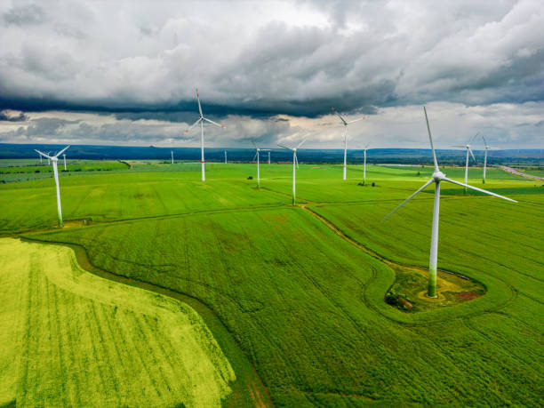 istock drone shot wind turbines in front of a storm 1401343755