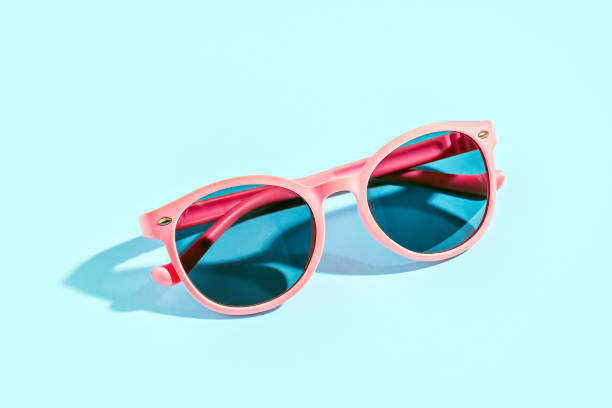 istock Pink sunglasses on mint color background 1401344769