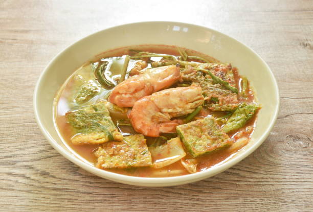 istock boiled shrimp and fried egg stuffed climbing wattle vegetable in spicy sour soup 1401344909