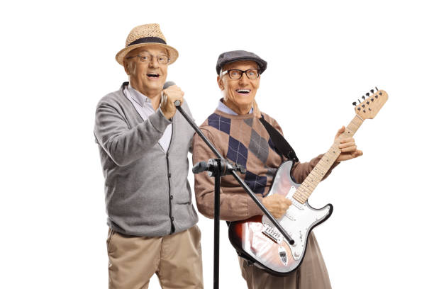 istock Elderly men playing guitars and singing on a microphone 1401345145