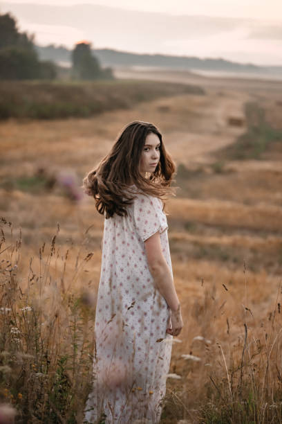istock The girl is posing in the field. 1401345724