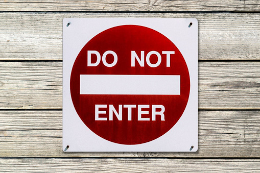 Do Not Enter Sign on wood background