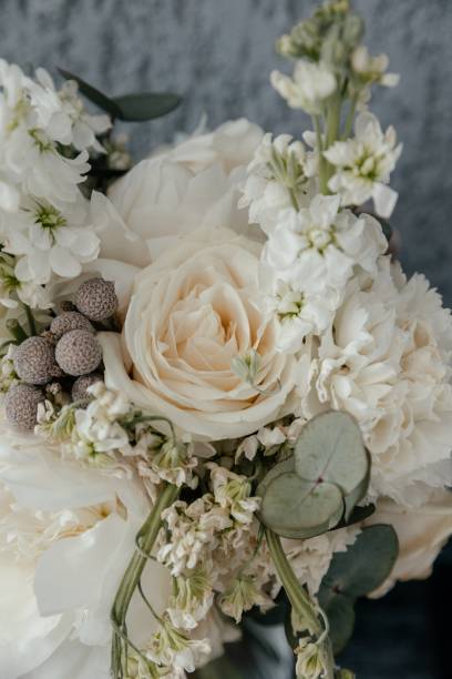 istock a bouquet of white roses and peonies close up, vertical image 1401345970