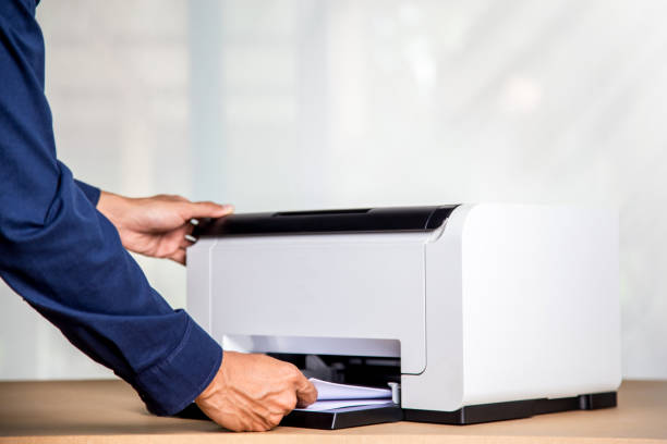 istock Printer, copier, scanner in office. Workplace ,photocopier machine for scanning document printing a sheet paper . 1401346271