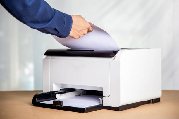 istock Printer, copier, scanner in office. Workplace ,photocopier machine for scanning document printing a sheet paper . 1401346275