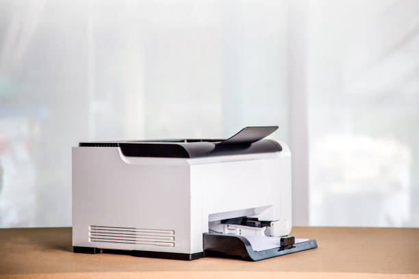 istock Printer, copier, scanner in office. Workplace ,photocopier machine for scanning document printing a sheet paper . 1401346281