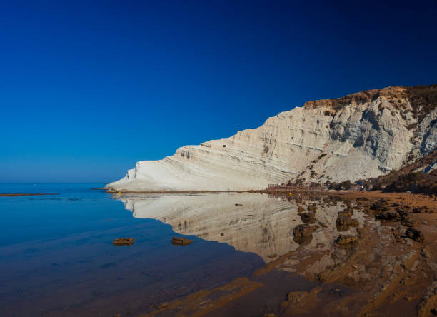 istock Limestone white cliffs with beach at the Scala dei Turchi, Realmonte. Agrigento 1401347464