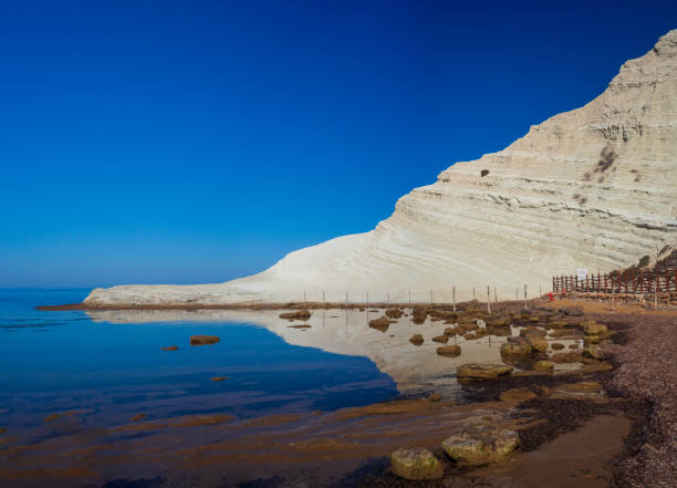istock Limestone white cliffs with beach at the Scala dei Turchi, Realmonte. Agrigento 1401347472