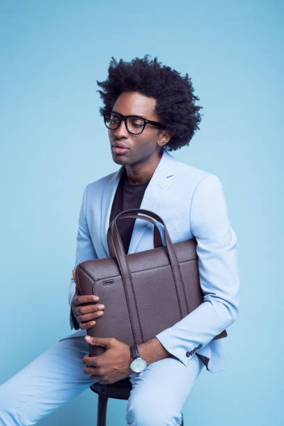 istock Contemplative businessman with briefcase 1401348548