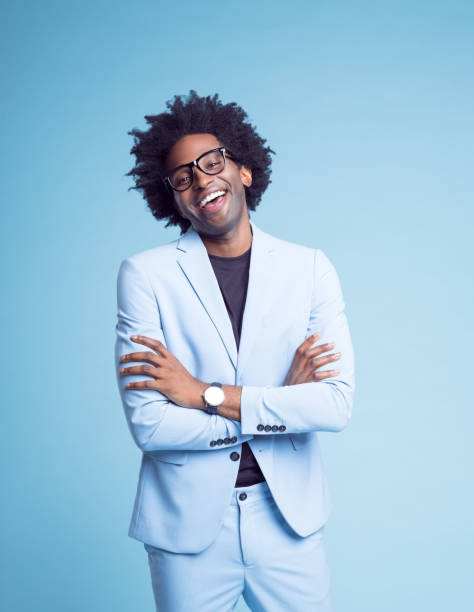 istock Happy businessman standing with arms crossed 1401348824