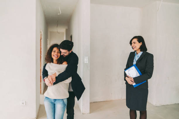 istock Real estate agent showing new home to clients 1401349309