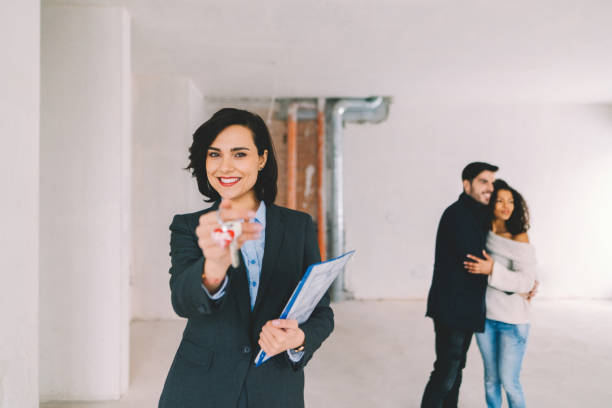 istock Real estate agent showing new home to clients 1401350665