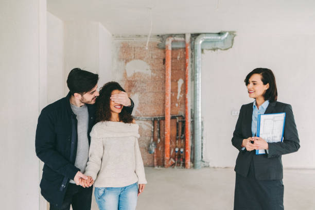 istock Real estate agent showing new home to clients 1401350723